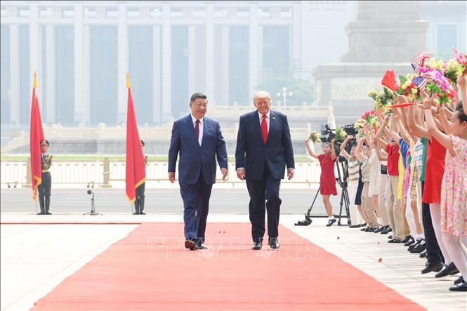 Chủ tịch Trung Quốc Tập Cận Bình và Tổng thống Mỹ Donald Trump tại lễ đón ở Bắc Kinh ngày 14/5/2026. Ảnh: THX/TTXVN